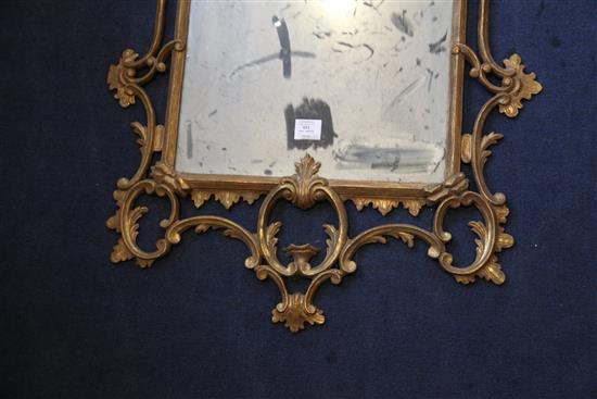 A George III giltwood carved and gesso wall mirror, 4ft 5in x 2ft 3in.